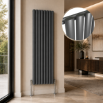 Alma Single Oval Vertical Designer Radiator 1600x480mm Anthracite installed in a luxury modern interior with close-up inset highlighting the oval tube anthracite finish.