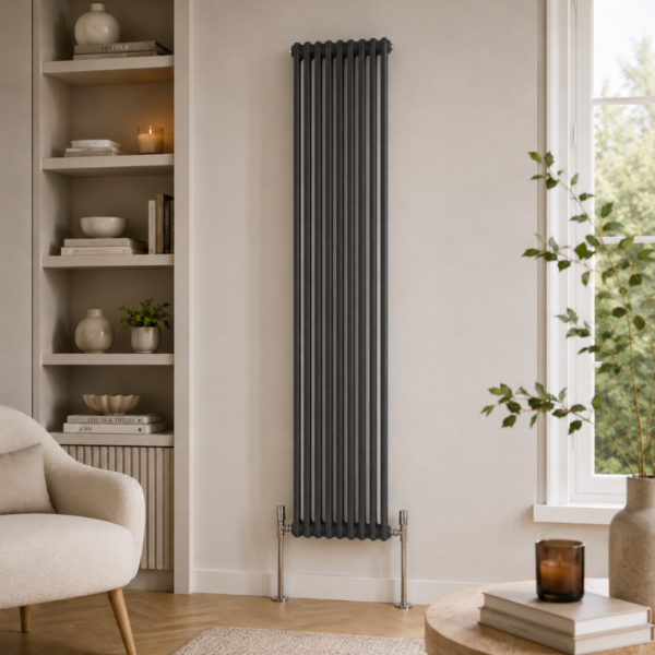 Aura 2 Column Vertical Radiator 1800x425mm Anthracite installed in a modern living room with neutral décor and wooden flooring.