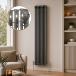 Aura 2 Column Vertical Radiator 1800x470mm Raw Metal installed in a modern living room with close-up inset showing the premium raw metal finish.