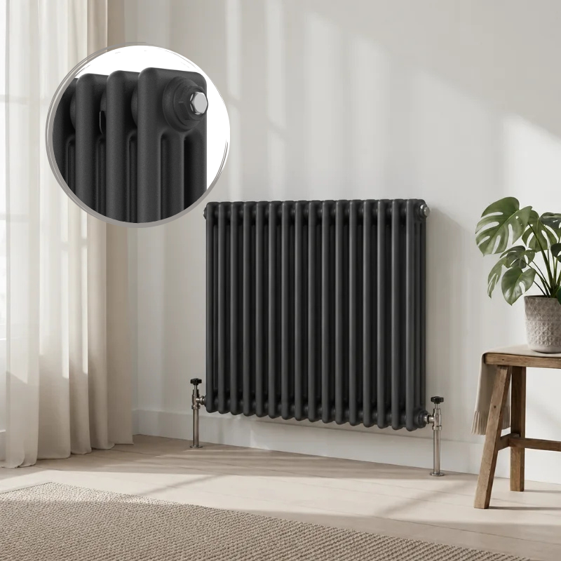 Aura 3 Column Horizontal Radiator 600mm x 605mm Anthracite Aura 3 Column Horizontal Radiator 600x605mm Anthracite installed in a modern living space with decorative wall panelling and wooden flooring.