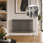 Aura 2 Column Horizontal Radiator 600x1100mm Raw Metal installed in a modern living room with wooden flooring and contemporary décor.