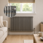 Aura 3 Column Horizontal Radiator 600x830mm Raw Metal installed beneath a window in a modern living room with close-up inset highlighting the premium raw metal finish.