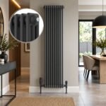 Anthracite Aura 3 column vertical radiator, 1800mm x 425mm, installed in a modern dining room.