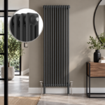 Anthracite 3-column vertical radiator installed in a modern living room or hallway