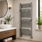 Large gun metal curved towel radiator in a modern industrial-style bathroom