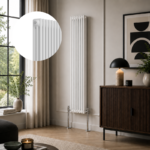 White 3-column vertical radiator installed in a modern living room or hallway