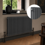 Anthracite 3-column horizontal radiator installed in a modern living room or hallway