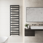 Tall matt black ladder towel radiator in a large modern bathroom with white and grey interior