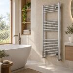Vela chrome designer towel radiator, 1200mm x 500mm, wall-mounted beside a freestanding bath.